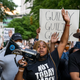 Porsche Queen Miller (center) and others march through the streets after the verdict was announced for Derek Chauvin on April 20, 2021 in Atlanta.